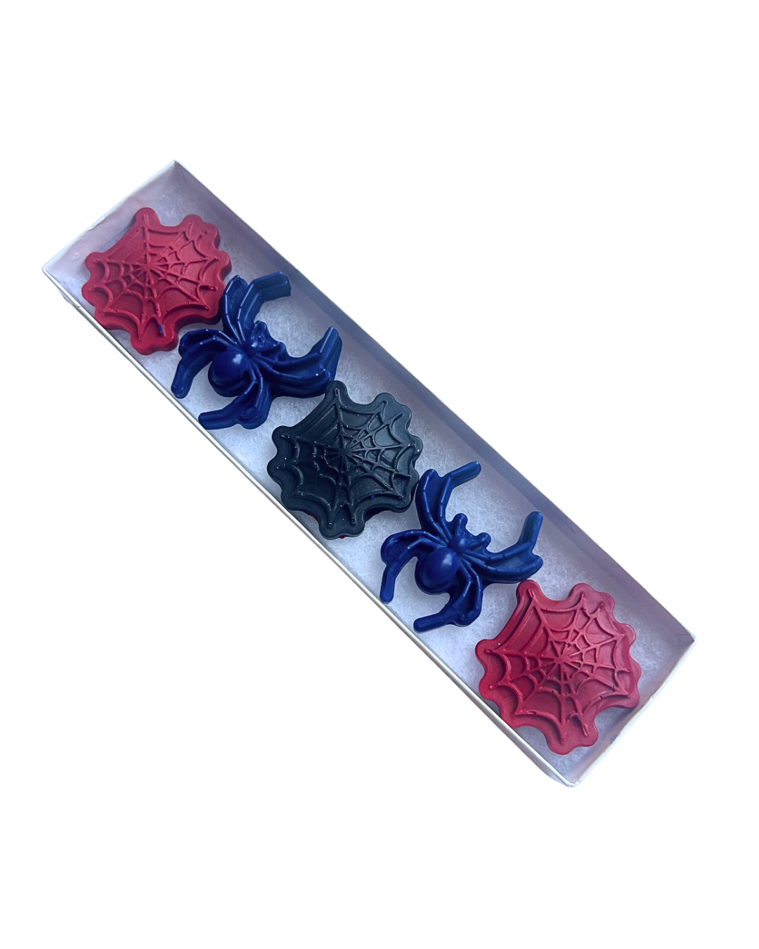 A set of five spider-themed crayons, featuring red, dark blue, and black colors, on a white background.