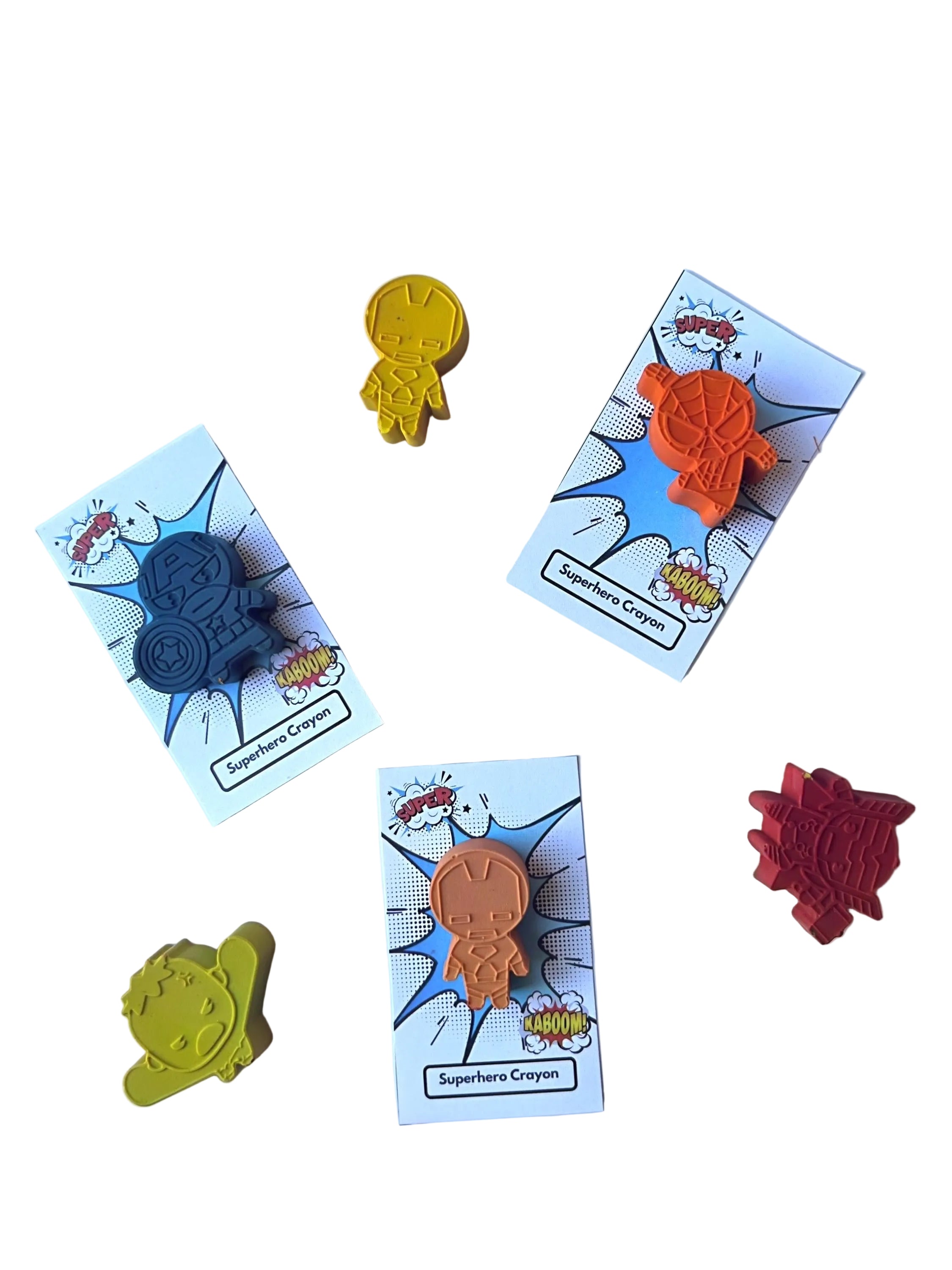 Superhero-themed crayons on cards with a white background